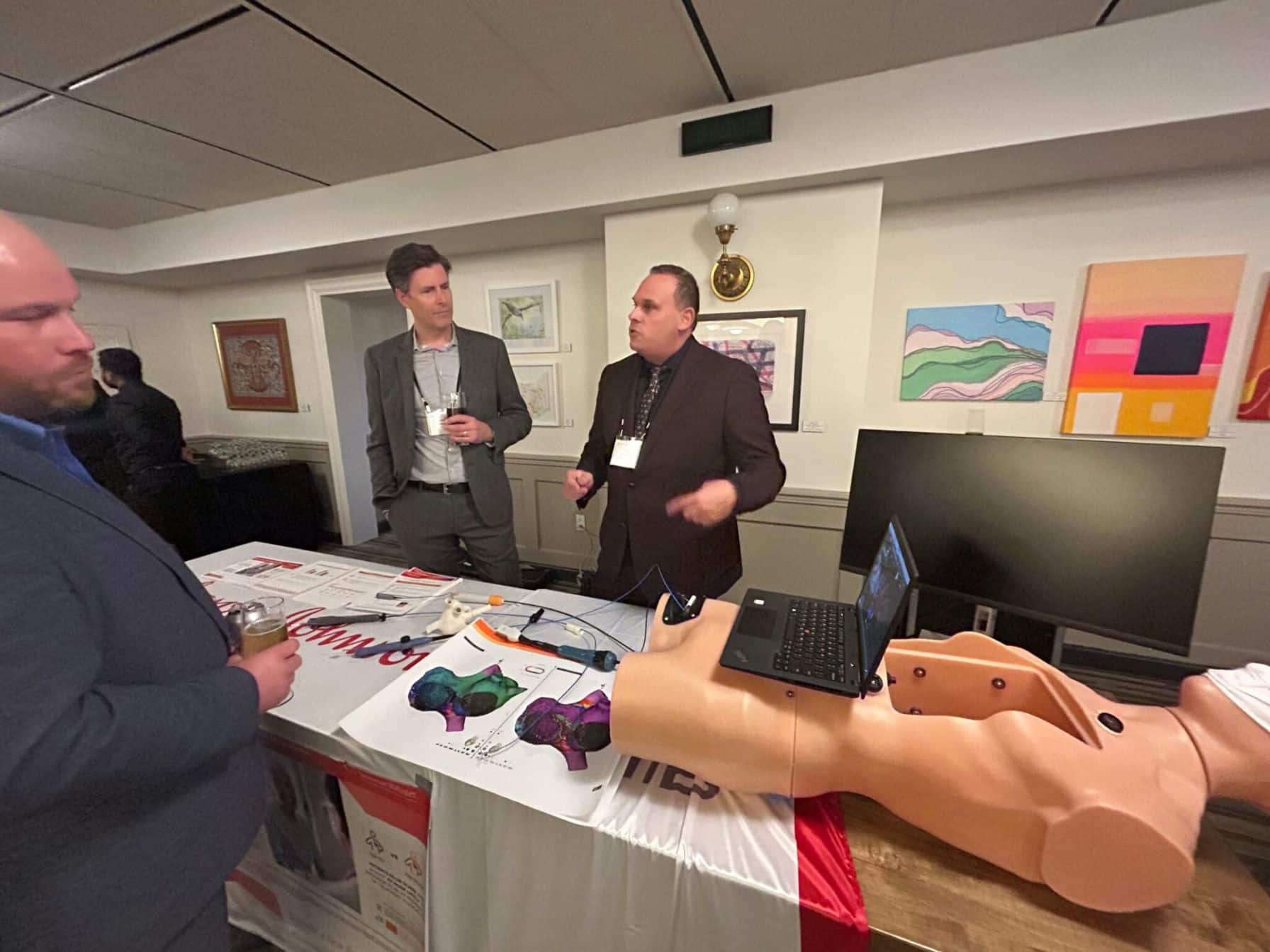 Men discussing medical training equipment
