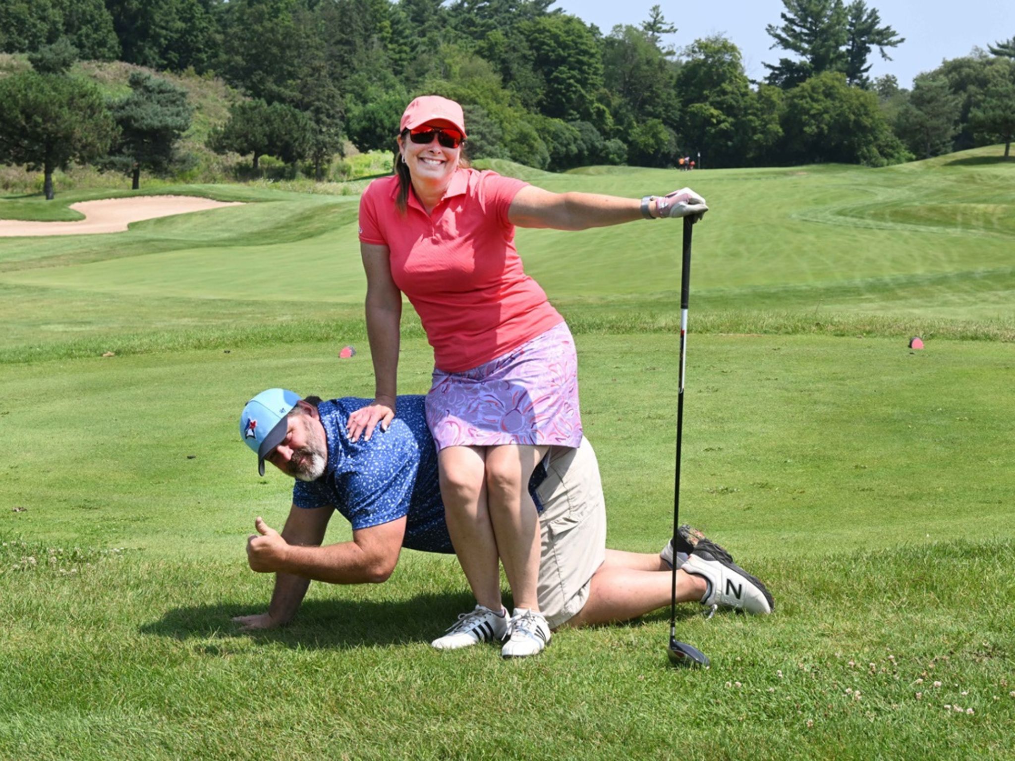 Playful golfers on a course