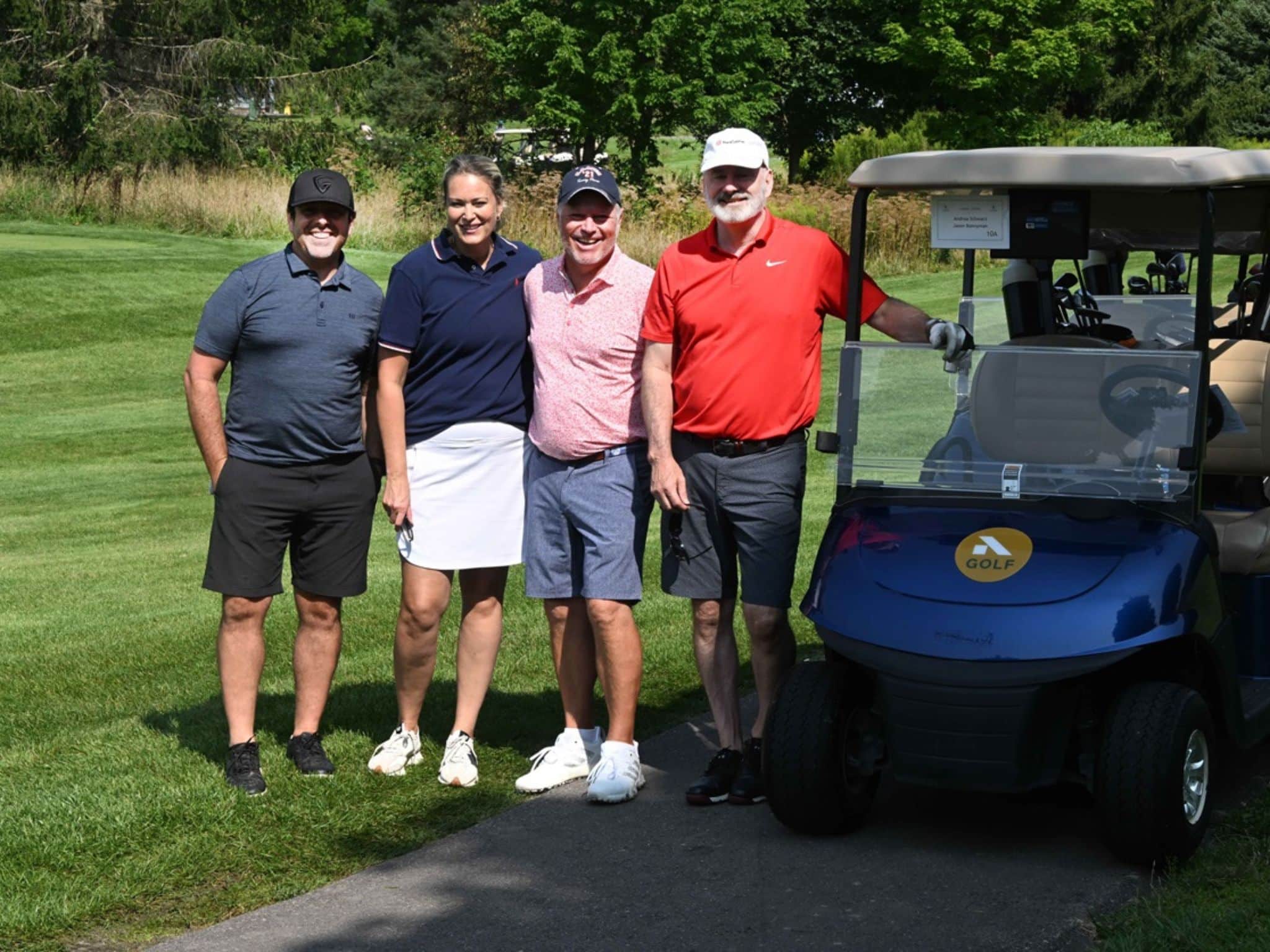 Group of four golfers on course