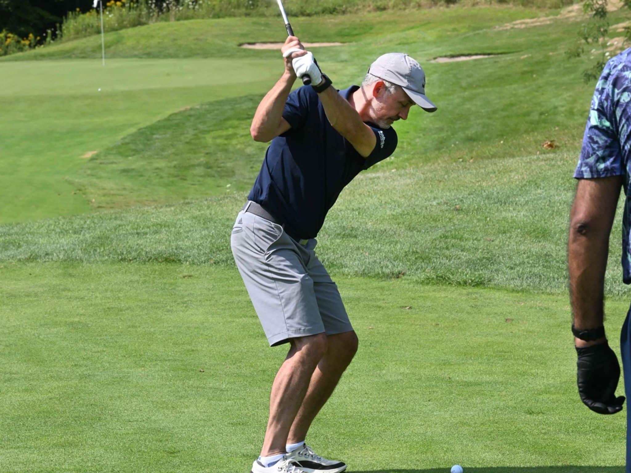 Golfer preparing to swing club