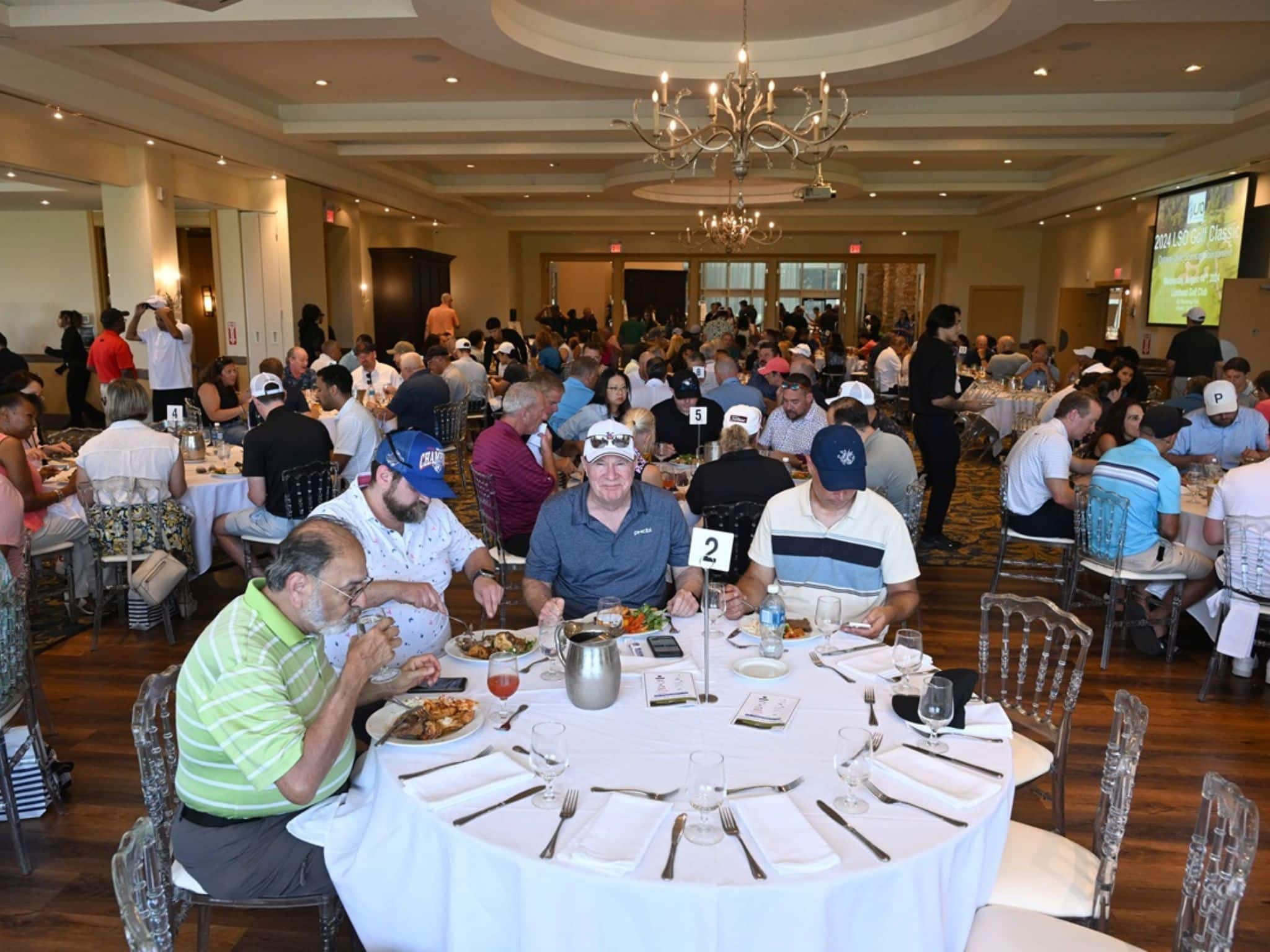Crowded dining room with guests eating