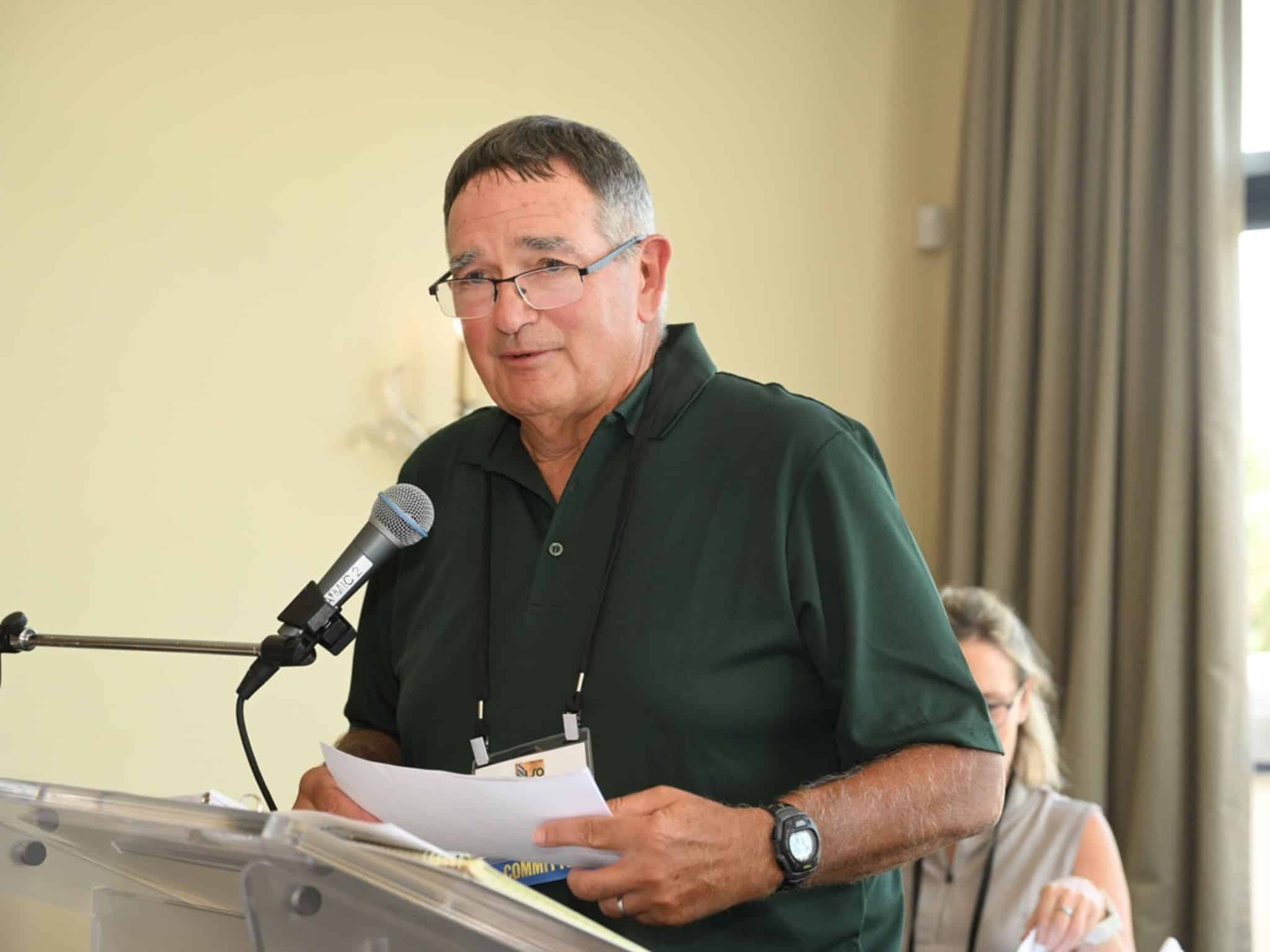 Man speaking at a podium