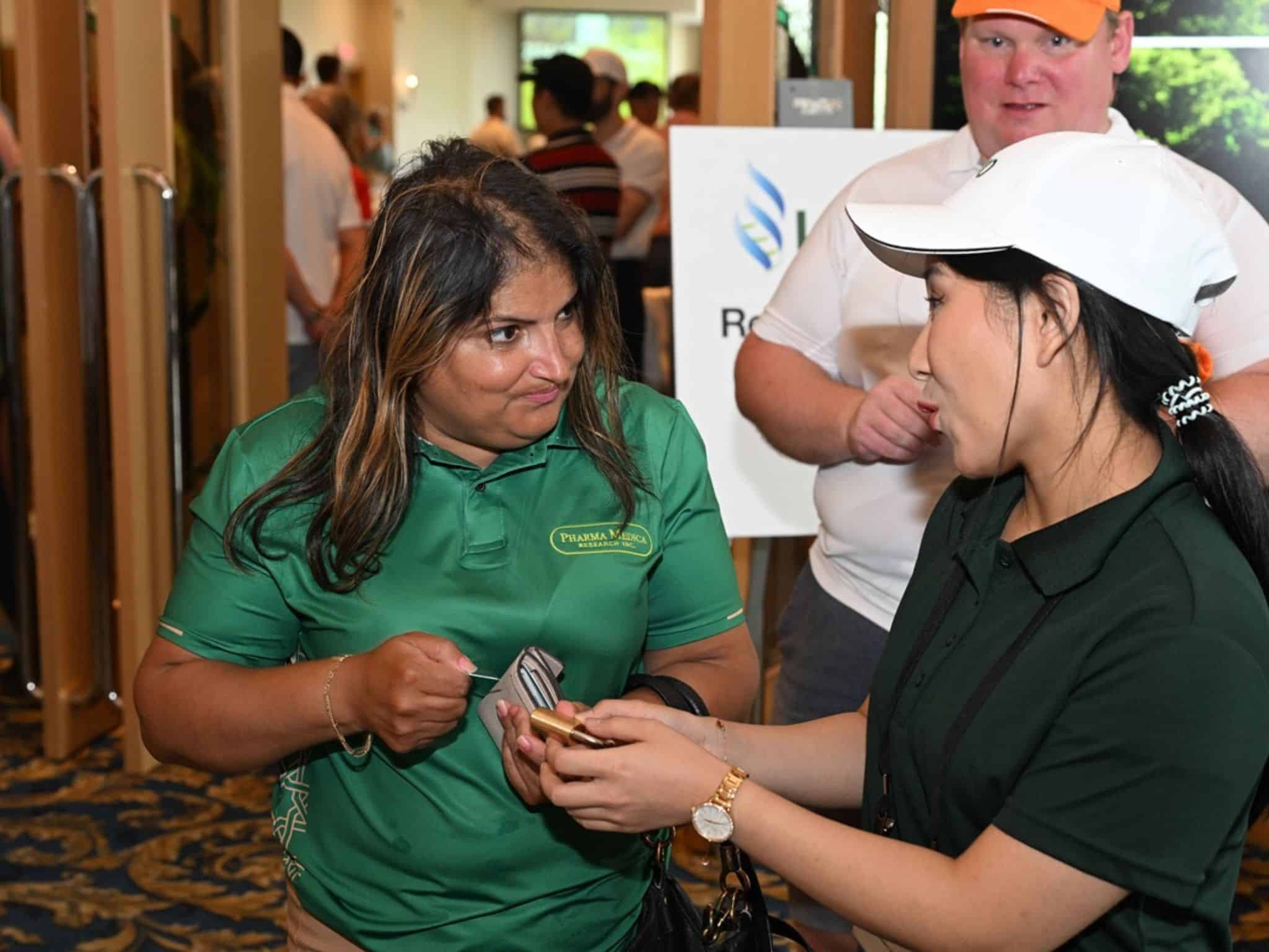 Two women interacting at event