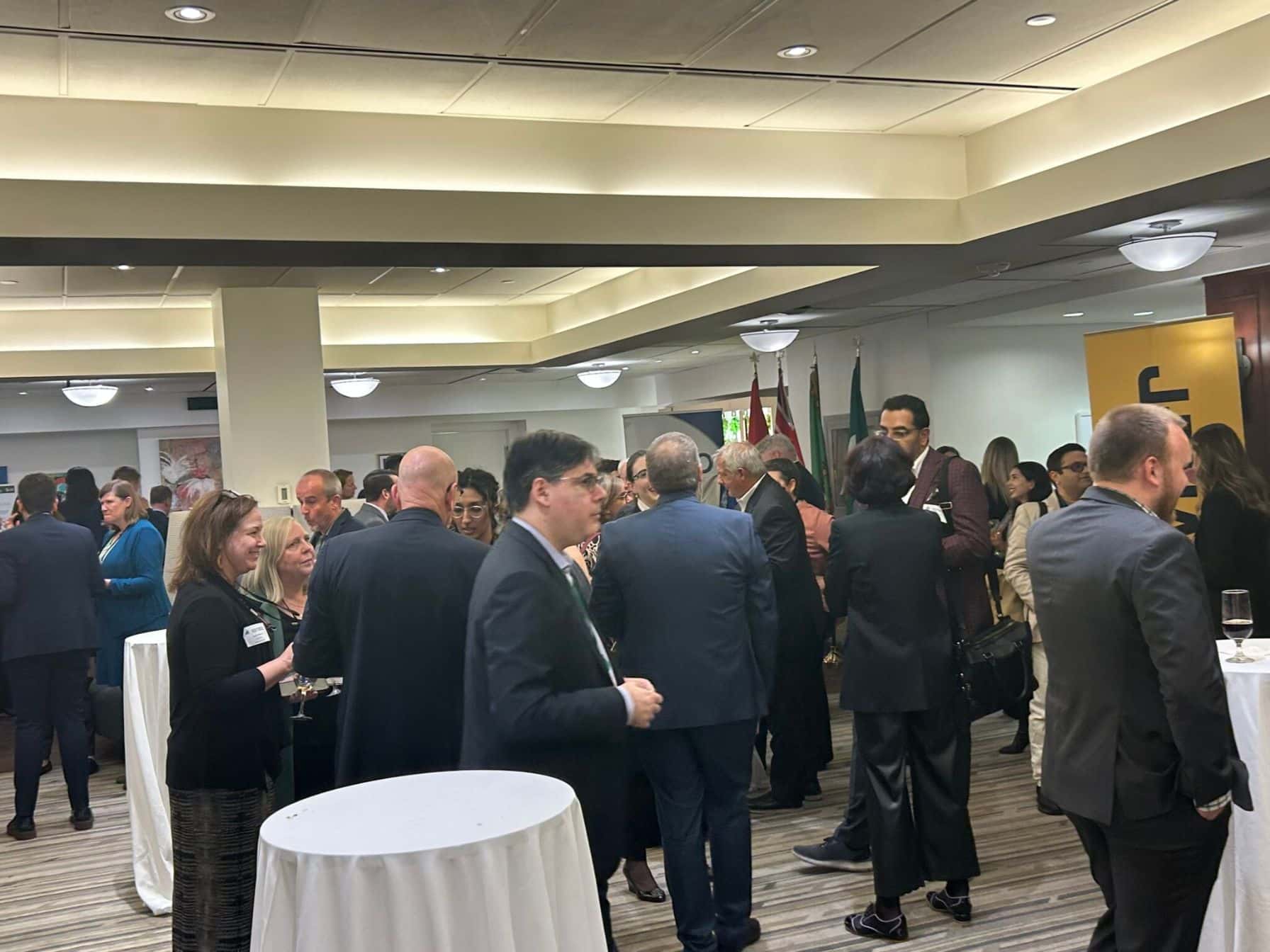 Crowded networking event with professionals.