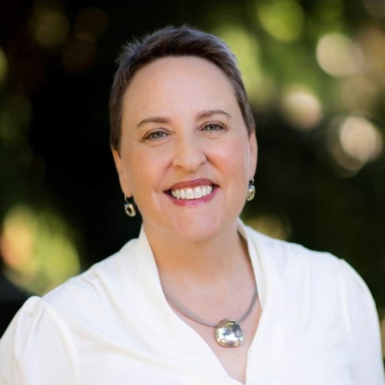 Smiling woman in white blouse